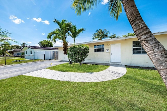 7771 Simms St, Hollywood, FL 33024 - ranch-style house featuring asphalt driveway