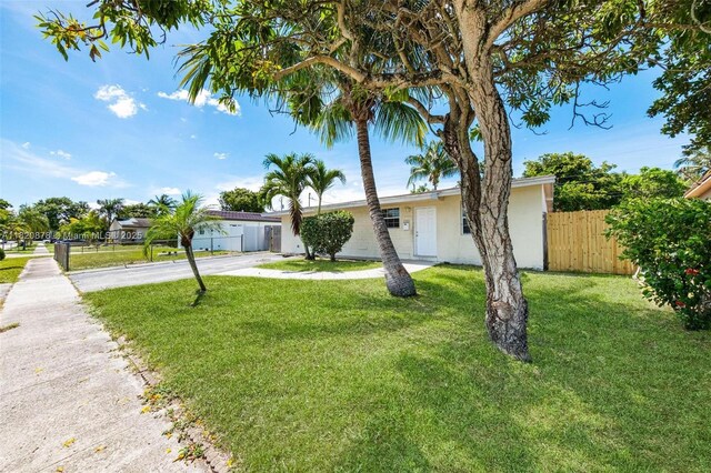 7771 Simms St, Hollywood, FL 33024 - view of front of home featuring stucco siding and driveway