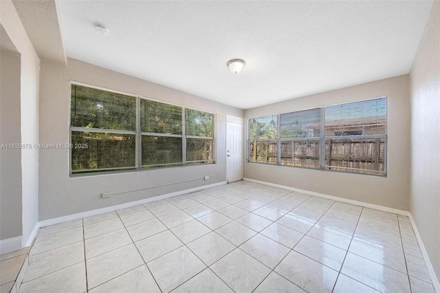 7771 Simms St, Hollywood, FL 33024 - tiled empty room featuring a smoke detector and baseboards