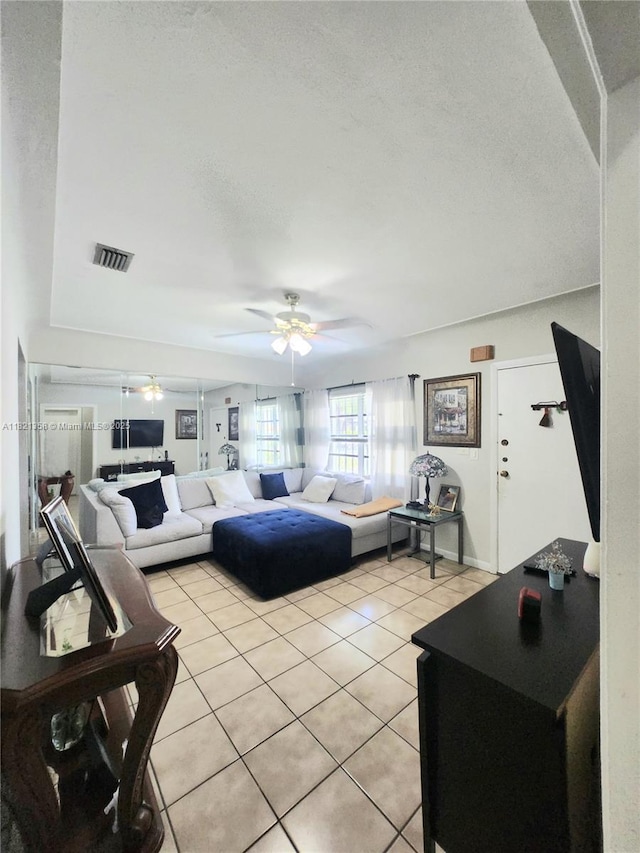 3082 NW 4th St, Miami, FL 33125 - living room featuring light tile patterned floors, a ceiling fan, and a textured ceiling