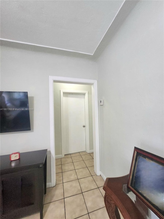 3082 NW 4th St, Miami, FL 33125 - hall with light tile patterned floors and baseboards