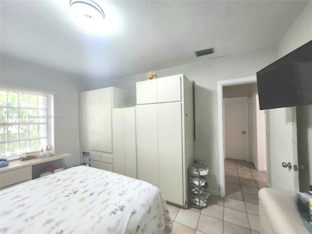 3082 NW 4th St, Miami, FL 33125 - bedroom with light tile patterned floors and a closet