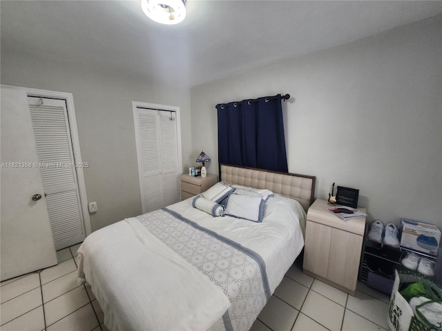 3082 NW 4th St, Miami, FL 33125 - bedroom with light tile patterned flooring and multiple closets
