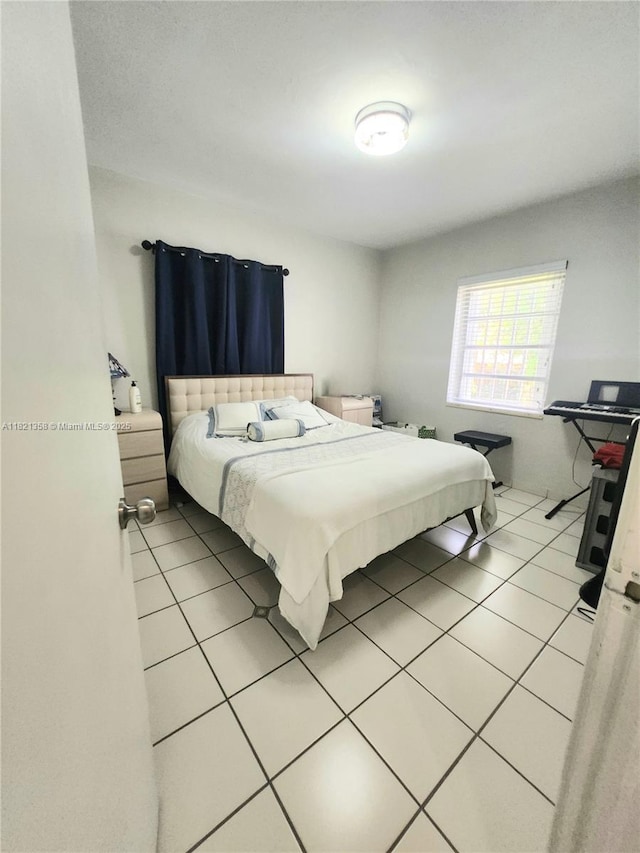3082 NW 4th St, Miami, FL 33125 - bedroom featuring light tile patterned floors