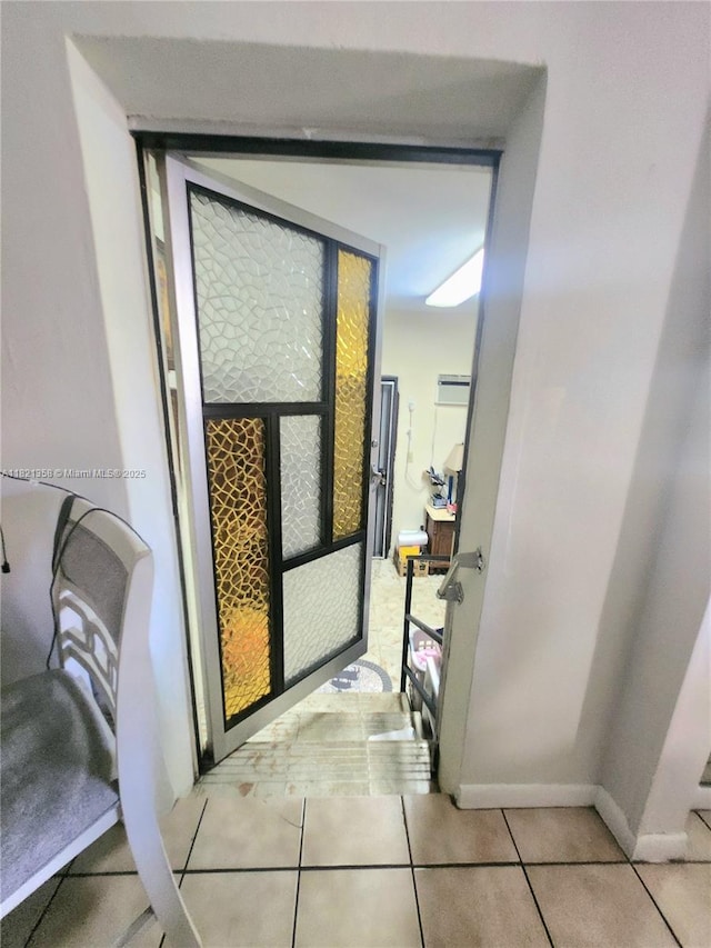 3082 NW 4th St, Miami, FL 33125 - entryway with light tile patterned flooring and baseboards