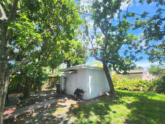 3082 NW 4th St, Miami, FL 33125 - view of side of home with a shed and stucco siding
