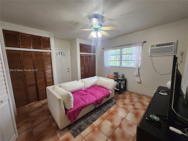 3082 NW 4th St, Miami, FL 33125 - living room with a wall mounted air conditioner, ceiling fan, and light tile patterned floors