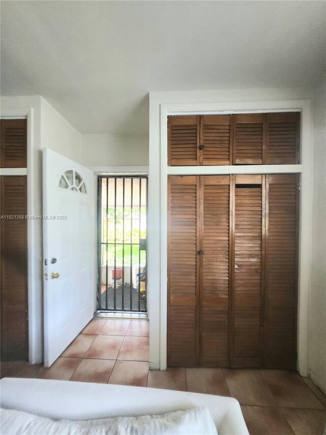 3082 NW 4th St, Miami, FL 33125 - unfurnished bedroom featuring tile patterned floors and a closet