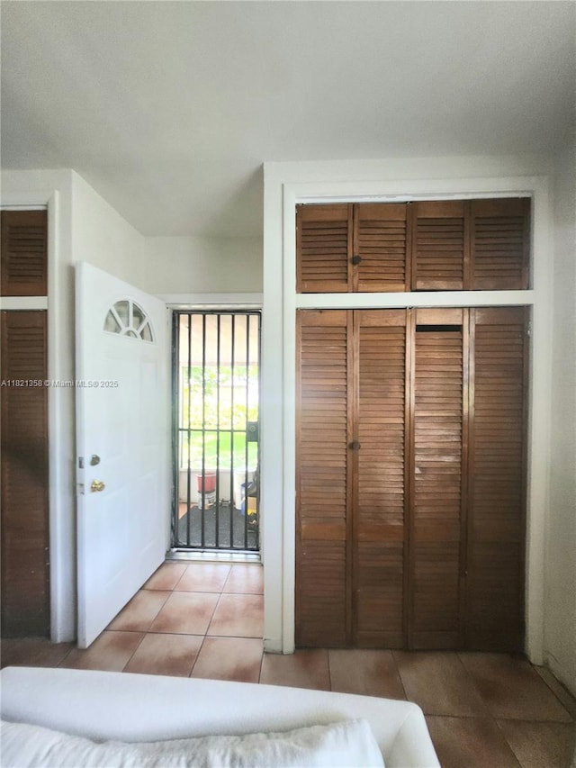 3082 NW 4th St, Miami, FL 33125 - unfurnished bedroom with tile patterned flooring and a closet