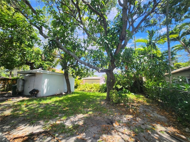 3082 NW 4th St, Miami, FL 33125 - view of yard with a storage unit