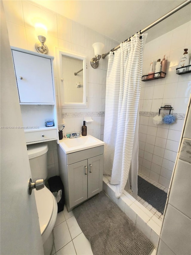 3082 NW 4th St, Miami, FL 33125 - bathroom with tile patterned flooring, a stall shower, vanity, and tile walls