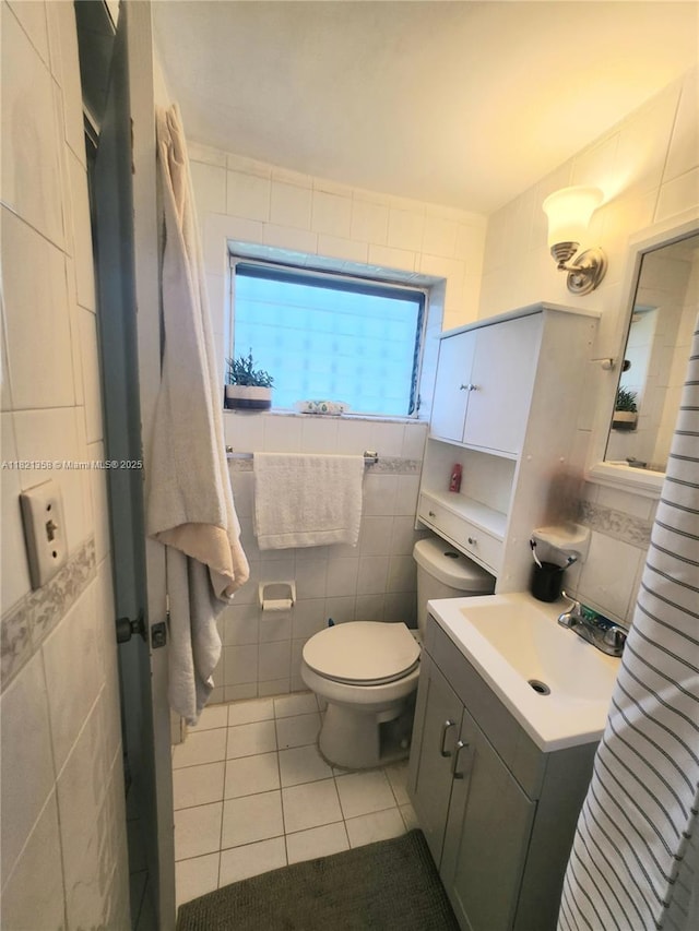 3082 NW 4th St, Miami, FL 33125 - bathroom featuring tile walls, tile patterned flooring, and vanity