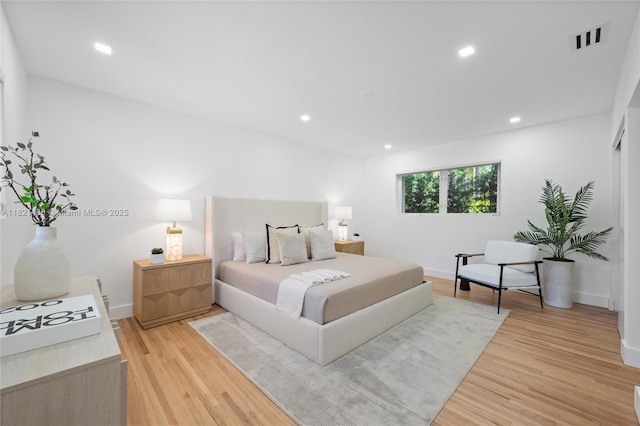 5211 Granada Blvd, Coral Gables, FL 33146 - bedroom with light wood-style floors and recessed lighting