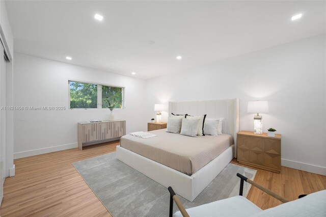 5211 Granada Blvd, Coral Gables, FL 33146 - bedroom with light wood-style floors and recessed lighting