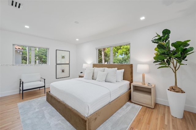5211 Granada Blvd, Coral Gables, FL 33146 - bedroom with multiple windows, light wood-style flooring, and recessed lighting