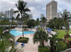 19390 Collins Ave Unit 207, Sunny Isles Beach, FL 33160 - community pool featuring a patio area and a view of city