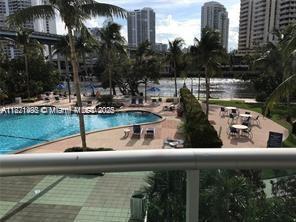 19390 Collins Ave Unit 207, Sunny Isles Beach, FL 33160 - community pool featuring a city view