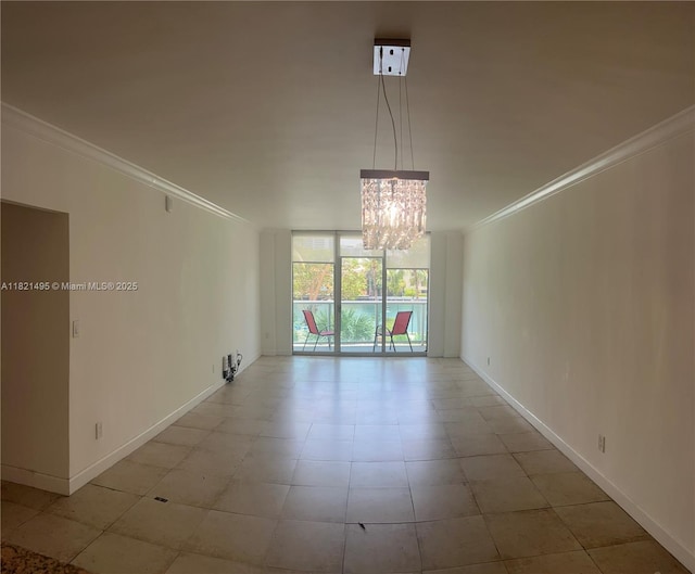 19390 Collins Ave Unit 207, Sunny Isles Beach, FL 33160 - empty room with ornamental molding, a chandelier, and floor to ceiling windows
