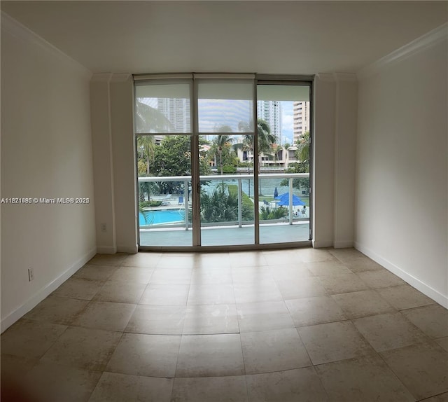 19390 Collins Ave Unit 207, Sunny Isles Beach, FL 33160 - spare room with a wall of windows and ornamental molding