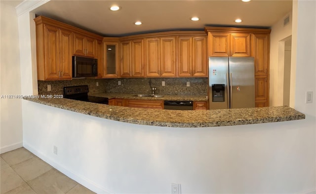 19390 Collins Ave Unit 207, Sunny Isles Beach, FL 33160 - kitchen with black appliances, a peninsula, glass insert cabinets, tasteful backsplash, and recessed lighting