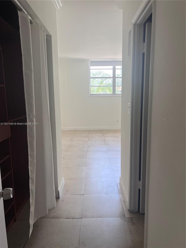 19390 Collins Ave Unit 207, Sunny Isles Beach, FL 33160 - hallway featuring baseboards