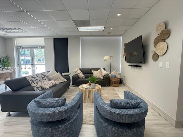 19390 Collins Ave Unit 207, Sunny Isles Beach, FL 33160 - living room featuring french doors and a drop ceiling