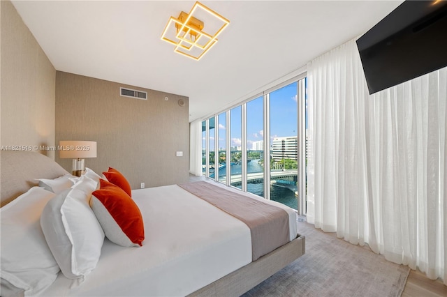 185 SW 7th St Unit 803, Miami, FL 33130 - bedroom with access to outside and floor to ceiling windows