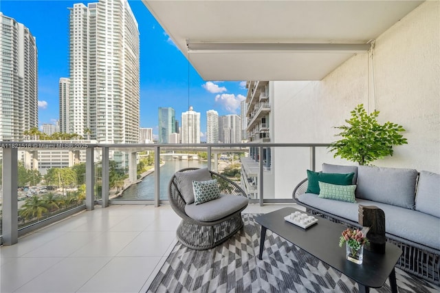 185 SW 7th St Unit 803, Miami, FL 33130 - balcony with a view of skyline, an outdoor living space, and a water view