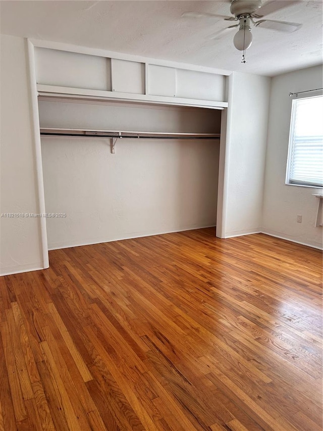 101 Collins Ave Unit 16, Miami Beach, FL 33139 - unfurnished bedroom featuring wood finished floors, a closet, and ceiling fan