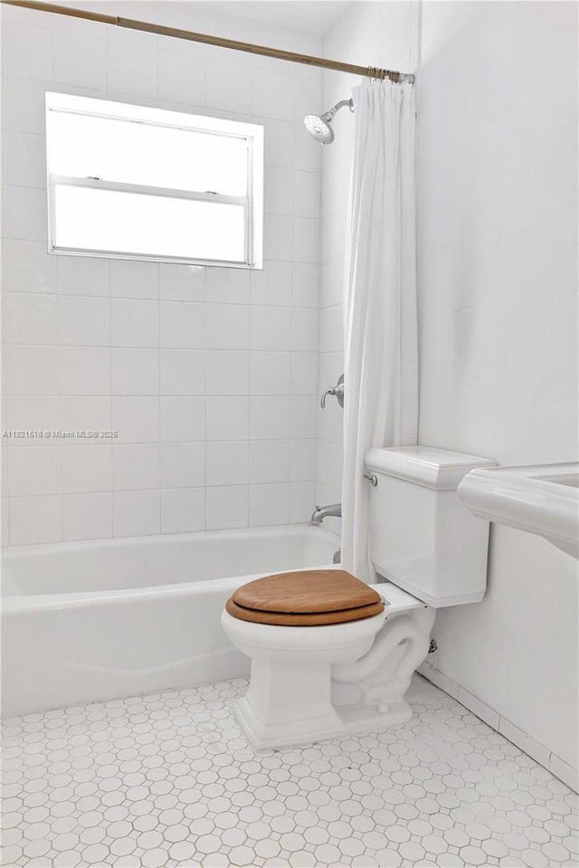 101 Collins Ave Unit 16, Miami Beach, FL 33139 - full bathroom with shower / tub combo and tile patterned floors
