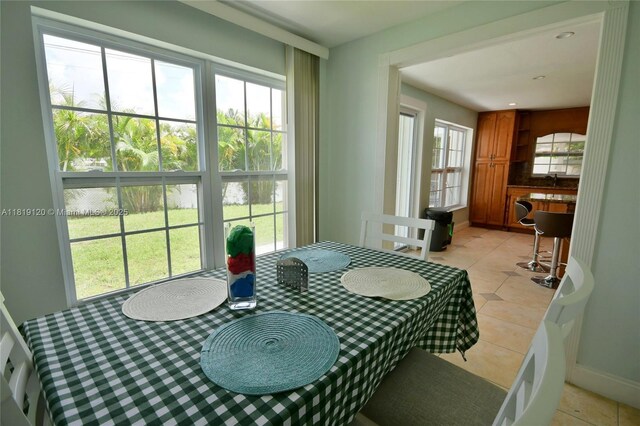 5815 S Farragut Dr, Hollywood, FL 33021 - dining area with light tile patterned floors and baseboards