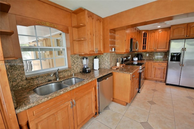 5815 S Farragut Dr, Hollywood, FL 33021 - kitchen featuring stainless steel appliances, open shelves, backsplash, dark stone counters, and brown cabinetry