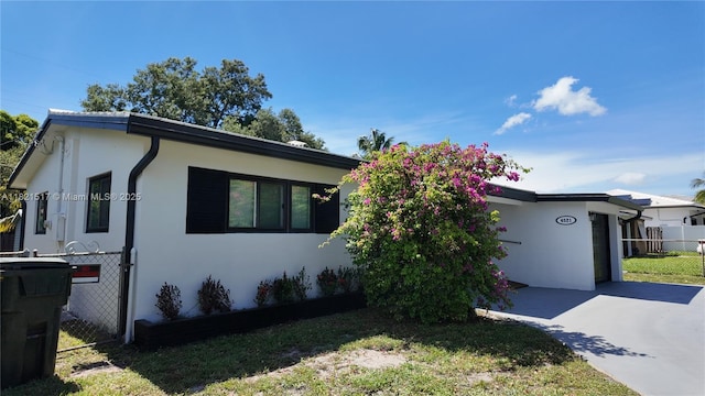 4521 SW 25th Ter, Dania Beach, FL 33312 - view of front facade with stucco siding and concrete driveway