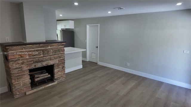4521 SW 25th Ter, Dania Beach, FL 33312 - unfurnished living room featuring wood finished floors, a fireplace, and recessed lighting