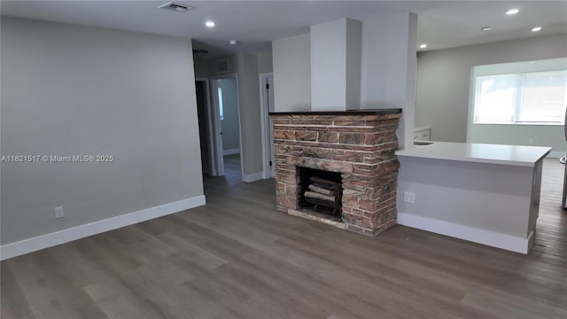 4521 SW 25th Ter, Dania Beach, FL 33312 - unfurnished living room with wood finished floors, a fireplace, and recessed lighting