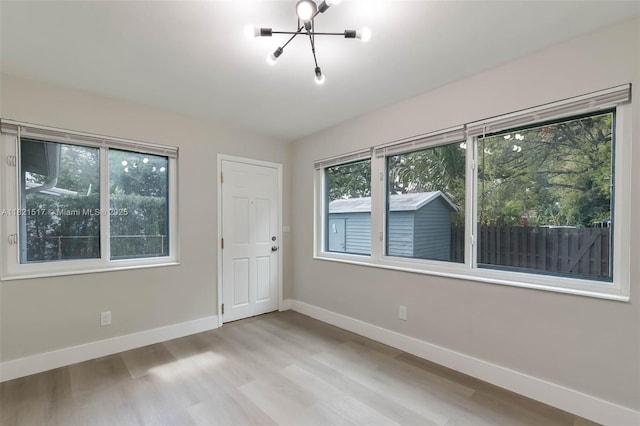 4521 SW 25th Ter, Dania Beach, FL 33312 - spare room with a chandelier and wood finished floors