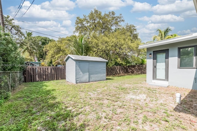 4521 SW 25th Ter, Dania Beach, FL 33312 - fenced backyard with a storage unit