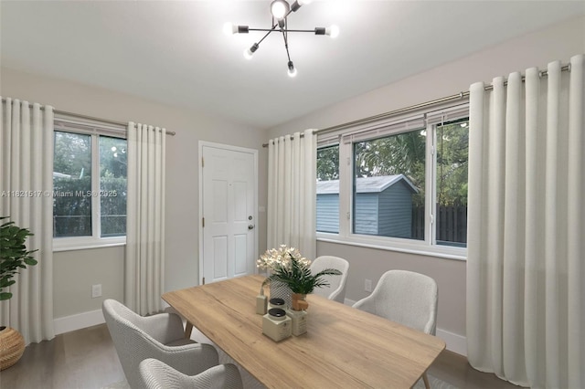 4521 SW 25th Ter, Dania Beach, FL 33312 - dining space featuring a chandelier and wood finished floors