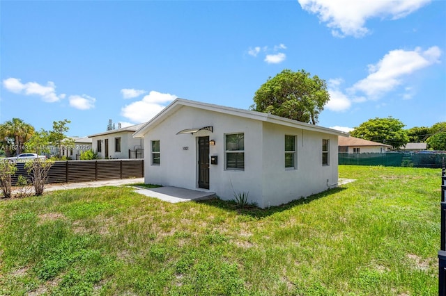 1001 NW 4th Ave, Pompano Beach, FL 33060 - rear view of property with stucco siding