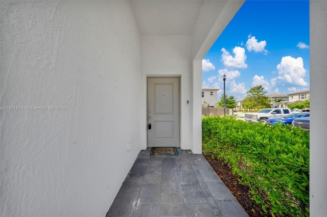 2699 SE 19th St, Homestead, FL 33035 - doorway to property featuring stucco siding