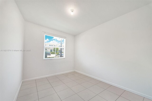 2699 SE 19th St, Homestead, FL 33035 - empty room featuring baseboards and light tile patterned flooring