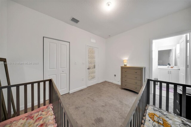 2699 SE 19th St, Homestead, FL 33035 - carpeted bedroom with baseboards and a closet