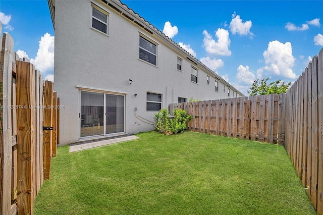2699 SE 19th St, Homestead, FL 33035 - rear view of property featuring stucco siding and a fenced backyard