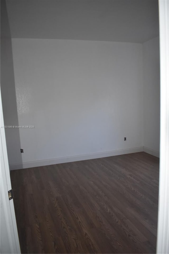 363 SW 1st Ter, Deerfield Beach, FL 33441 - empty room with dark wood-style floors