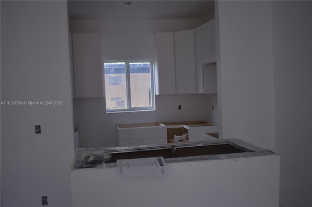 363 SW 1st Ter, Deerfield Beach, FL 33441 - kitchen featuring white cabinetry