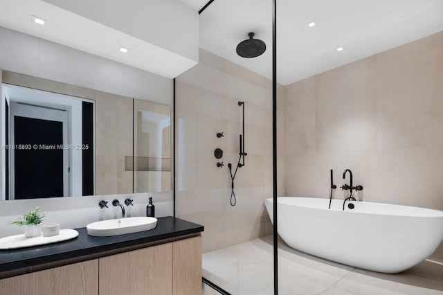 11 Island Ave Unit Ph2, Miami Beach, FL 33139 - full bath with walk in shower, vanity, a freestanding bath, and recessed lighting