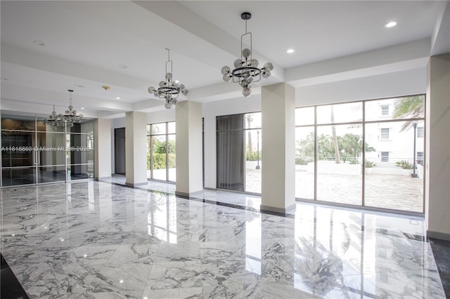 11 Island Ave Unit Ph2, Miami Beach, FL 33139 - empty room featuring a chandelier, marble tiled floors, and recessed lighting