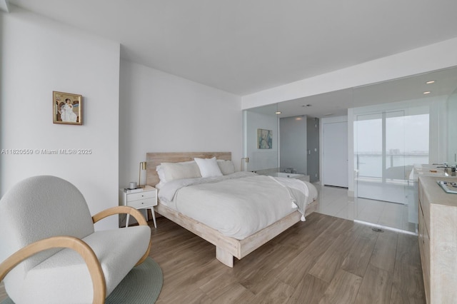 650 NE 32nd St Unit 1904, Miami, FL 33137 - bedroom with light wood-style flooring and recessed lighting