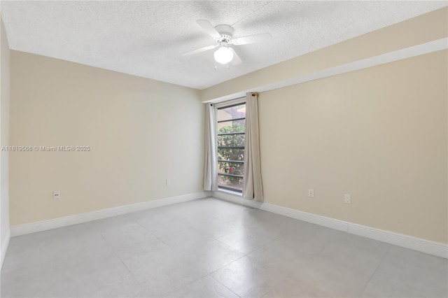 8860 SW 123rd Ct Unit K-104, Miami, FL 33186 - empty room featuring a textured ceiling, a ceiling fan, and light tile patterned flooring