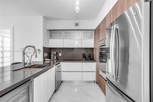 325 S Biscayne Blvd Unit 2515, Miami, FL 33131 - kitchen featuring stainless steel appliances, modern cabinets, beverage cooler, and light marble finish flooring